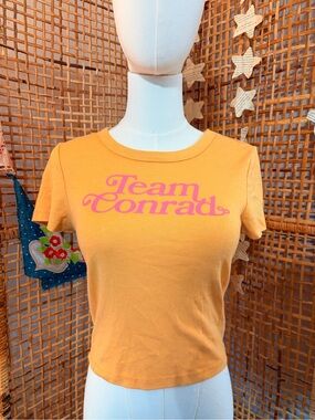 American Eagle Outfitters Orange Crop Tee with Pink 'Team Conrad' Graphic